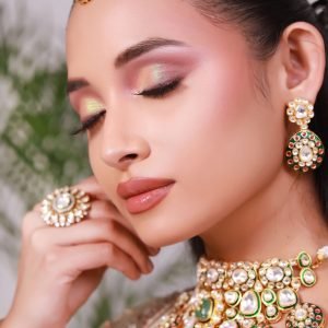 Home Close-up portrait of an elegant Indian bride showcasing traditional jewelry and makeup.